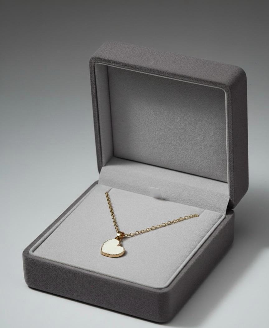 Gold Chain with Heart Charm.