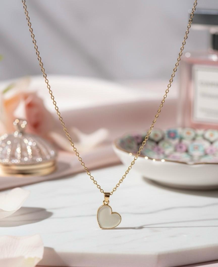 Gold Chain with Heart Charm.
